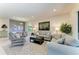Spacious living room with neutral walls, recessed lighting, comfortable sofas and stylish decor at 17696 Northwood Pl, Lakewood Ranch, FL 34202