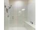 Modern bathroom showcasing a tiled walk-in shower with glass door and seat at 17696 Northwood Pl, Lakewood Ranch, FL 34202