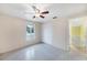 Bedroom with a ceiling fan, window and a closet at 18348 Yale Ave, Port Charlotte, FL 33948