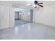 Bright bedroom features a ceiling fan and sliding glass doors at 18348 Yale Ave, Port Charlotte, FL 33948