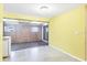 Cozy living room with yellow walls and sliding glass doors leading to another room at 18348 Yale Ave, Port Charlotte, FL 33948