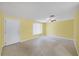 Bright living room with terrazzo floors, ceiling fan and neutral wall color at 18348 Yale Ave, Port Charlotte, FL 33948