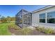 A screened lanai is outside this home at 2309 Blue Mahoe Ln, Sarasota, FL 34240