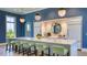 Stunning kitchen with a large island, pendant lighting, and a butler's pantry featuring a round mirror at 2309 Blue Mahoe Ln, Sarasota, FL 34240