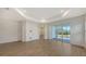 Open living space showcasing tile flooring, neutral walls, and seamless access to the patio at 2309 Blue Mahoe Ln, Sarasota, FL 34240