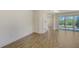 Living area with ceramic floors, modern trim and doors to the lanai at 2309 Blue Mahoe Ln, Sarasota, FL 34240