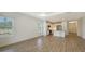 Bright living area showcases tile floors, white walls, and windows for natural light at 2309 Blue Mahoe Ln, Sarasota, FL 34240
