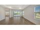 Open living space showcases tile flooring, neutral walls, and seamless access to the patio at 2309 Blue Mahoe Ln, Sarasota, FL 34240