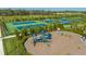 Community playground with swings and a slide set beside new pickleball courts in a well-maintained park at 2309 Blue Mahoe Ln, Sarasota, FL 34240