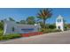 Windward Lakewood Ranch sign with flowers and a clock tower on a sunny day at 2309 Blue Mahoe Ln, Sarasota, FL 34240