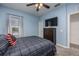 Comfortable bedroom with ceiling fan, plush carpet, and dark wood furniture at 2347 123Rd E Pl, Parrish, FL 34219