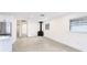 Bright living room featuring neutral tile floors and a sleek wood-burning stove at 2539 Huntington Ave, Sarasota, FL 34232
