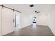 Bright room with gray tile floors and barn-style sliding doors at 2539 Huntington Ave, Sarasota, FL 34232
