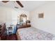 Bright bedroom with wood flooring, a bed, large window, and a classic dresser at 2678 Rock Creek Dr, Port Charlotte, FL 33948