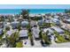 A view of some beach homes with a glimpse of the turquoise ocean in the background at 2714 Avenue C, Holmes Beach, FL 34217