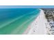 A gorgeous beach with pristine white sand and clear blue water; perfect for relaxation at 2714 Avenue C, Holmes Beach, FL 34217