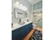 Bathroom featuring modern vanity with vessel sink and glass enclosed shower with a built-in bench at 321 Reclinata Cir, Venice, FL 34292