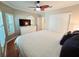 Well-lit bedroom features a queen-sized bed, closet, and a ceiling fan at 321 Reclinata Cir, Venice, FL 34292