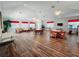 Large community room with seating and tables, plus access to fitness and kitchen areas at 321 Reclinata Cir, Venice, FL 34292