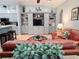 Living room with entertainment center, breakfast bar, and comfortable seating at 321 Reclinata Cir, Venice, FL 34292