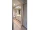 Well-lit bathroom featuring a white vanity with ample storage and a large mirror above the sink at 3702 54Th W Dr # 103, Bradenton, FL 34210