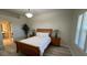 Serene bedroom featuring a wooden bed frame, two nightstands with lamps, and a bathroom view at 3702 54Th W Dr # 103, Bradenton, FL 34210