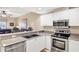 Kitchen featuring granite countertops and stainless steel appliances open to Living Area at 3702 54Th W Dr # 103, Bradenton, FL 34210