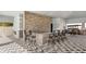 Community outdoor bar area with a stone-faced counter, bar seating, and stylish decor at 4005 Direct Green Pl, Bradenton, FL 34208