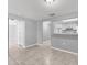 Open living space with tile floors flows into the kitchen, enhancing the home's layout at 4027 Dyer Ln, Sarasota, FL 34232