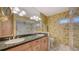 Vintage bathroom featuring a double vanity with a stone countertop, a toilet, and a spacious marble-tiled shower at 5055 Gulf Of Mexico Dr # 331, Longboat Key, FL 34228