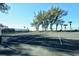 Enjoy a competitive game on the community tennis court, surrounded by mature trees and lush landscaping at 5055 Gulf Of Mexico Dr # 331, Longboat Key, FL 34228