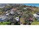 Aerial view of the property surrounded by mature trees in a residential neighborhood at 51 Webb St, Osprey, FL 34229
