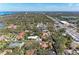 Panoramic aerial view of the neighborhood showcasing the abundance of trees and surrounding areas at 51 Webb St, Osprey, FL 34229