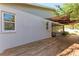 A view of the house from the backyard featuring a covered patio and shade awning at 51 Webb St, Osprey, FL 34229