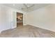 Bedroom featuring herringbone floors and glass doors leading to kitchen at 51 Webb St, Osprey, FL 34229