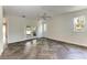 Spacious bedroom features neutral walls, herringbone floors, and access to the backyard at 51 Webb St, Osprey, FL 34229