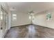 Bright and airy bedroom featuring herringbone floors, ceiling fan, and backyard views at 51 Webb St, Osprey, FL 34229
