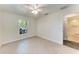 This bedroom features neutral walls, tiled floors and a window with a view at 51 Webb St, Osprey, FL 34229