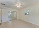 Bedroom featuring neutral walls, tile floors, ceiling fan and mirrored closet doors at 51 Webb St, Osprey, FL 34229