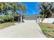 Beautiful home in a desirable location with lush landscaping, mature trees, and a two-car garage at 51 Webb St, Osprey, FL 34229