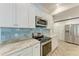 Updated kitchen featuring stainless appliances, tiled backsplash, and modern cabinetry at 51 Webb St, Osprey, FL 34229