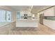 Modern kitchen featuring an island, stainless appliances, and stylish backsplash at 51 Webb St, Osprey, FL 34229