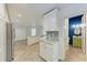 Open kitchen view showcasing marble counters, stainless appliances, and white cabinetry at 51 Webb St, Osprey, FL 34229