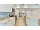 Well-equipped kitchen with stainless appliances, marble countertops, and modern cabinets at 51 Webb St, Osprey, FL 34229