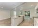 Spacious kitchen island boasts marble countertop, stainless steel appliances, and backyard access at 51 Webb St, Osprey, FL 34229