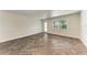 Inviting living room with updated flooring, a bright window, and a stylish door at 51 Webb St, Osprey, FL 34229