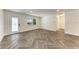 Bright living room with a stylish front door and window, showcasing modern flooring at 51 Webb St, Osprey, FL 34229