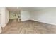 Open living area featuring modern flooring and a glimpse of the kitchen at 51 Webb St, Osprey, FL 34229