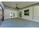 This spacious screened-in patio has doors that lead to both the home's interior and backyard at 51 Webb St, Osprey, FL 34229