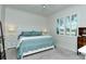 Inviting bedroom showcases a plush bed, plantation shutters, and a calming color palette at 5220 Hyland Hills Ave # 1211, Sarasota, FL 34241